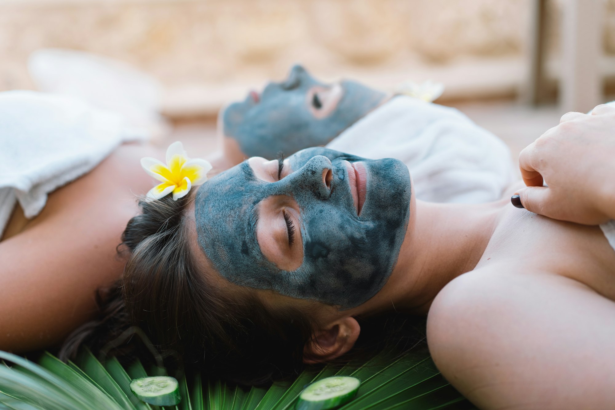 Beautiful Women getting facial care. Spa relaxation concept.