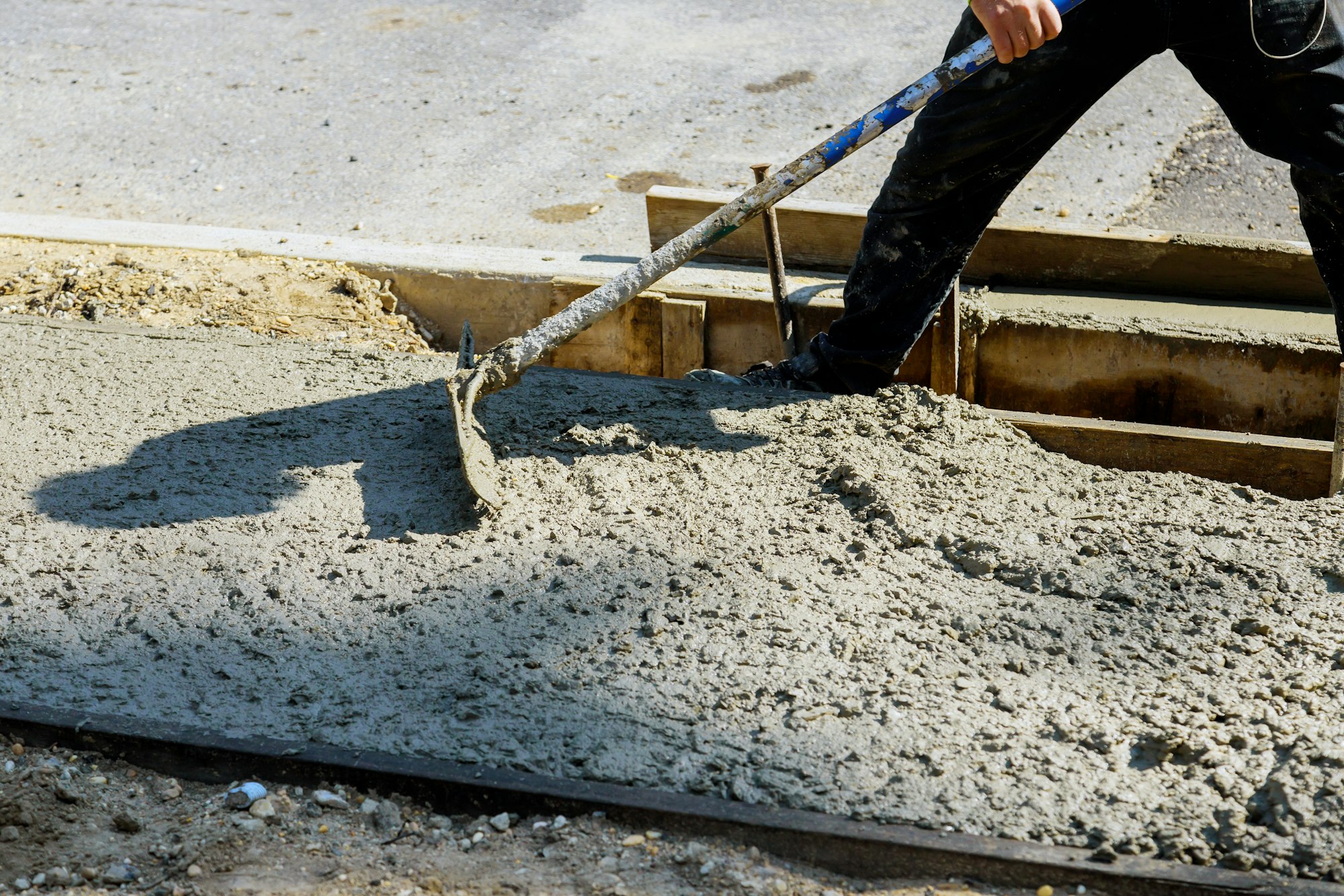 Cement of sidewalk a new building under construction